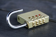 Combination Padlock On Wooden Table