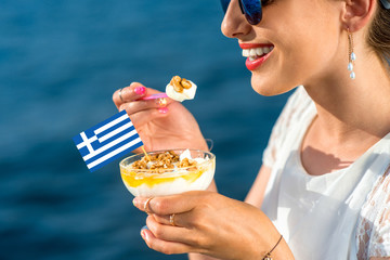 Woman eating greek yogurt