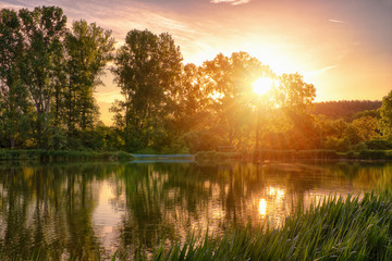 Beautiful fishing lake in sunrise