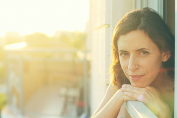 Portrait of beautiful 35 years old woman on sunset colors