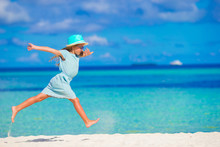 Adorable Little Girl Running On Tropical White Beach