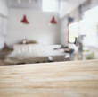 Wooden table top counter bar with blurred kitchen background