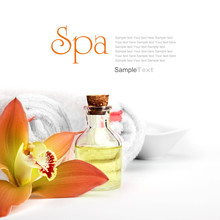Spa Concept. Orange Orchid, Oil, Vessel And White Towels.