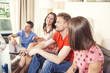 © rilueda - Friends at home watching TV and having fun
