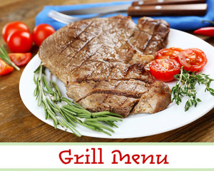 Canvas Print - Delicious grilled meat on plate on table and space for text