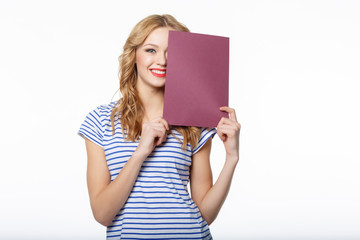 Wall Mural - Happy young female holding a blank billboard on white background