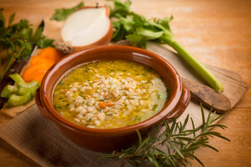 Wall Mural - barley soup with vegetables, selective focus