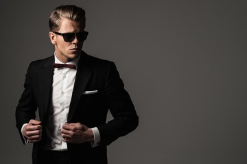 Tough sharp dressed man in black suit