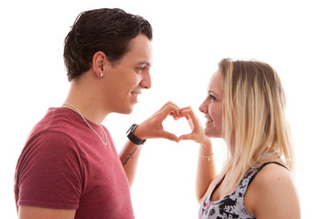 Wall Mural - Young couple making heart with hands