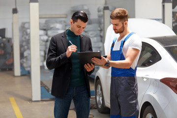 Auto Mechanic And Customer in Auto Repair Shop