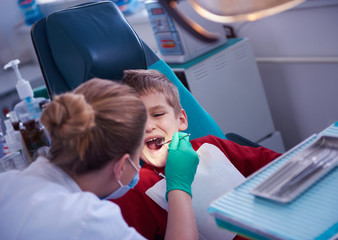 Wall Mural - Young boy in a dental surgery