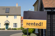 'Rented' sign outside a house