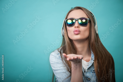 Fotografia, Obraz Cheerful Hipster woman with headphones and glasses