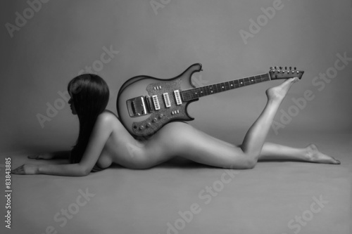 Naklejka ścienna young sexy woman with guitar