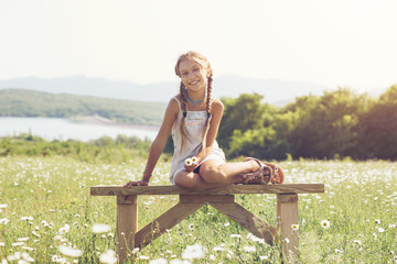 Wall Mural - Little girl in flower field