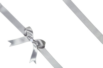 Wall Mural - Silver ribbon with bow on white background