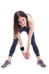 Wall Mural - Cheerful sporty woman doing stretching exercise