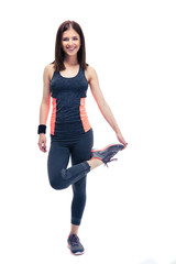 Sticker - Smiling sports woman stretching leg