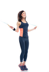 Sticker - Smiling woman doing exercises with jumping rope