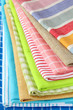 stack of colorful kitchen napkins on white background