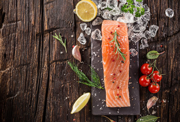 Salmon steak on wooden table