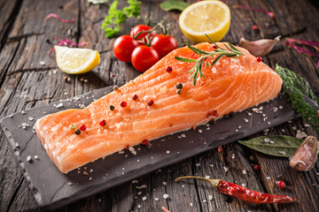 Salmon steak on wooden table