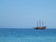 Old wooden old ship in blue sea