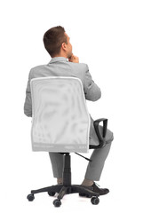 Wall Mural - businessman sitting in office chair from back