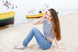 Fototapeta Natura - Beautiful stylish girl at sea pier
