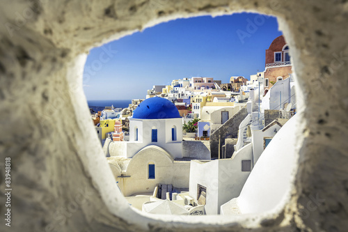 Fotografie, Obraz Santorini blue dome church look through the chimney, Greece