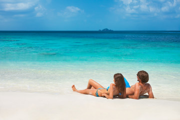 Wall Mural - young couple on the tropical beach