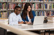 © Jale Ibrak - Happy Students Working With Laptop In Library