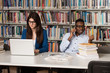 © Jale Ibrak - Young Students Using Their Laptop In A Library