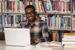 © Jale Ibrak - Young Student Using His Laptop In A Library