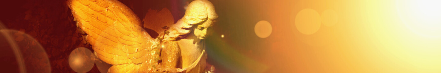 golden angel in the sunlight (antique statue)