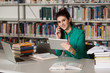 © Jale Ibrak - Beautiful College Student Using Mobile Phone In Library