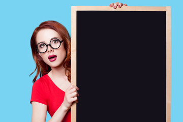 Wall Mural - girl in red dress with blackboard