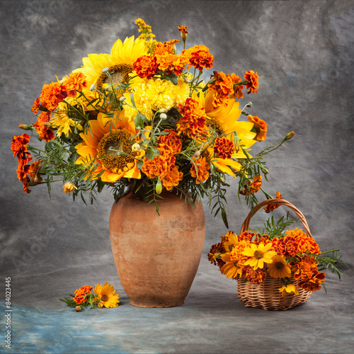 Fototapeta na wymiar Autumn still life. Flowers on the table