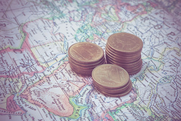 coin and a map  with filter effect retro vintage style