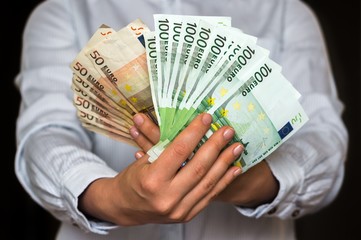 Poster - Young woman with euro money banknotes