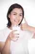 © Nonwarit - Laughing young woman with a glass of milk