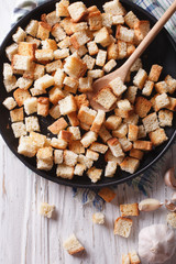 Wall Mural - Homemade delicious croutons with garlic vertical top view
