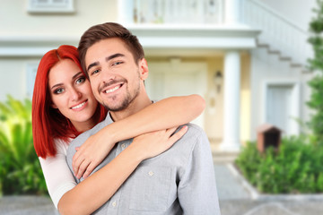 Poster - Loving couple near their house