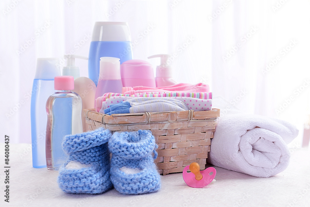 Baby accessories on table on light background