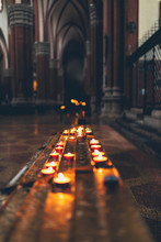 Rows Of Burning Spiritual Candles In A Church