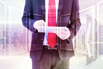 Aufkleber - Composite image of businessman scrolling on his digital tablet