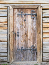 A Door In A Wooden Wall.