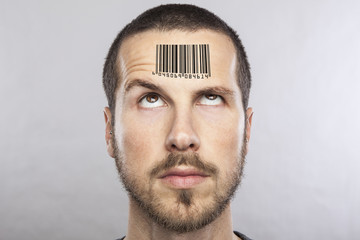 Wall Mural - young man with a bar code on his forehead