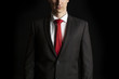 © Tommaso Lizzul - close up dark portrait of an anonymous businessman on black back