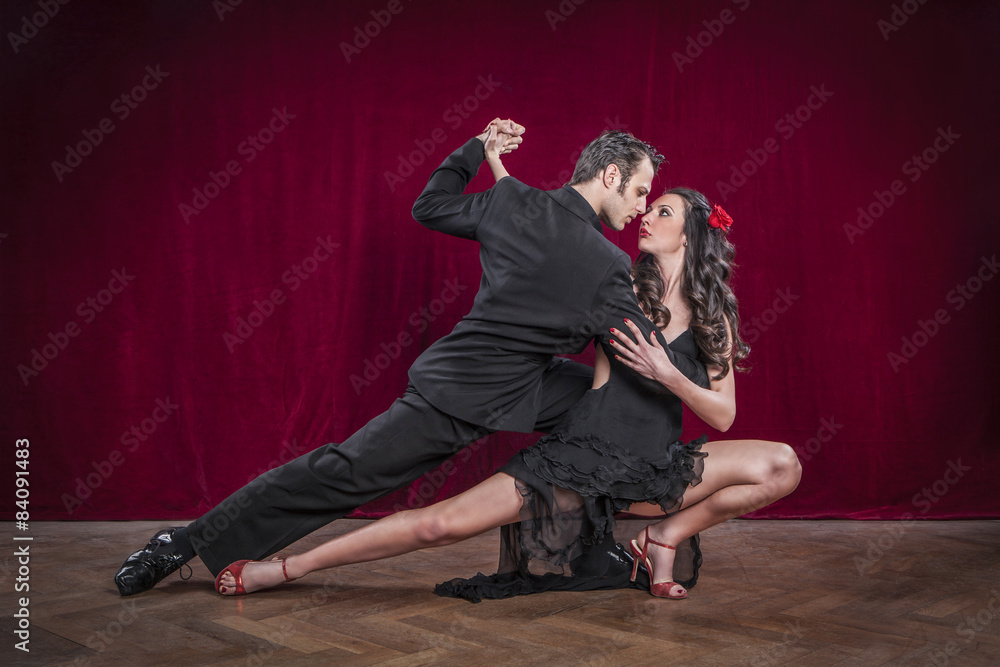 Portrait of young elegant tango dancers. - obrazy, fototapety, plakaty 